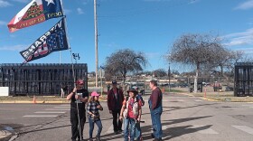 Trump supporters stand in front of Shelby Park in Eagle Pass, Tx