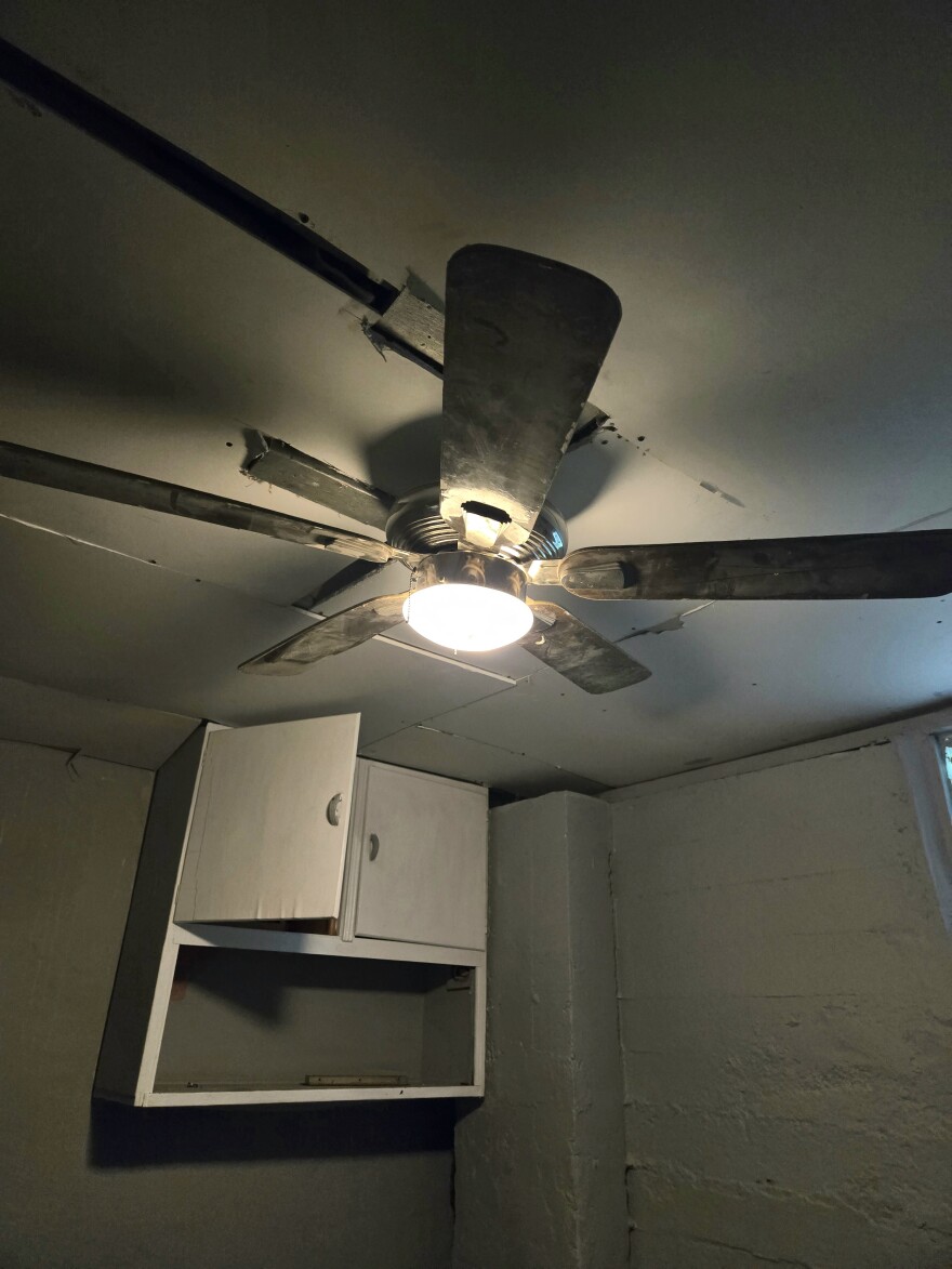 Earl Hollis says he's worried about the safety of some of the modifications to his rented house, like the ceiling around this ceiling fan.