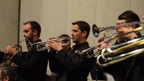 UMKC Conservatory Assistant Professor of Trumpet Matthew Vangjel (center) with other brass players.
