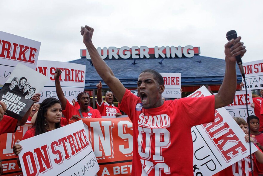 "Walking off the job, you're taking on your boss head-on, and that sounds like some pretty scary stuff, right?" says fast-food worker Terrence Wise, shown here at a 2013 strike in Kansas City, Mo. "But I always thought, what am I more afraid of? Taking on my boss or being homeless again with my three little girls?"