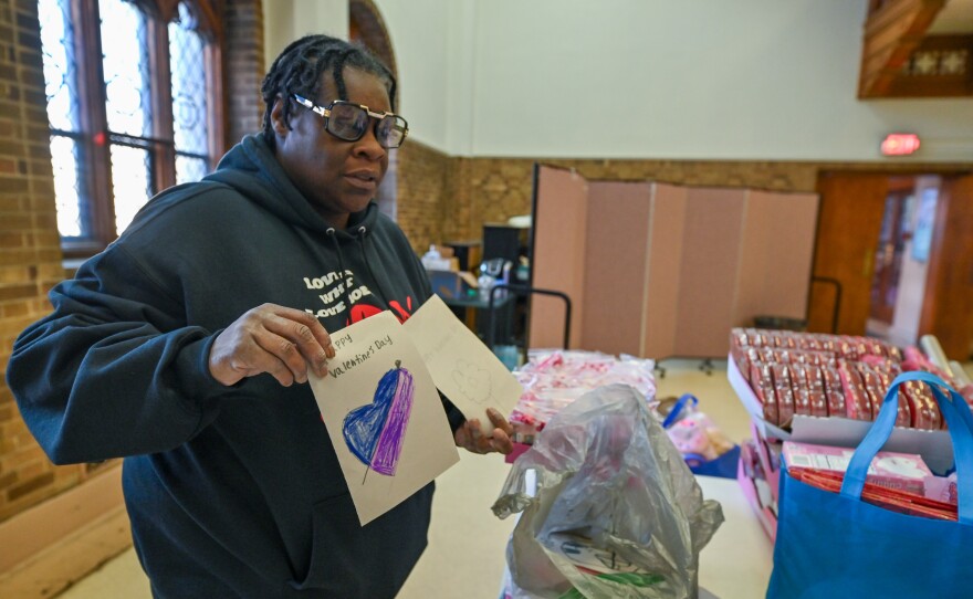 Sharee Clark shows handmade cards that were delivered to assisted living facilities.