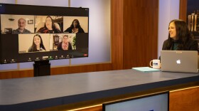 Show host talks to guests via Zoom.