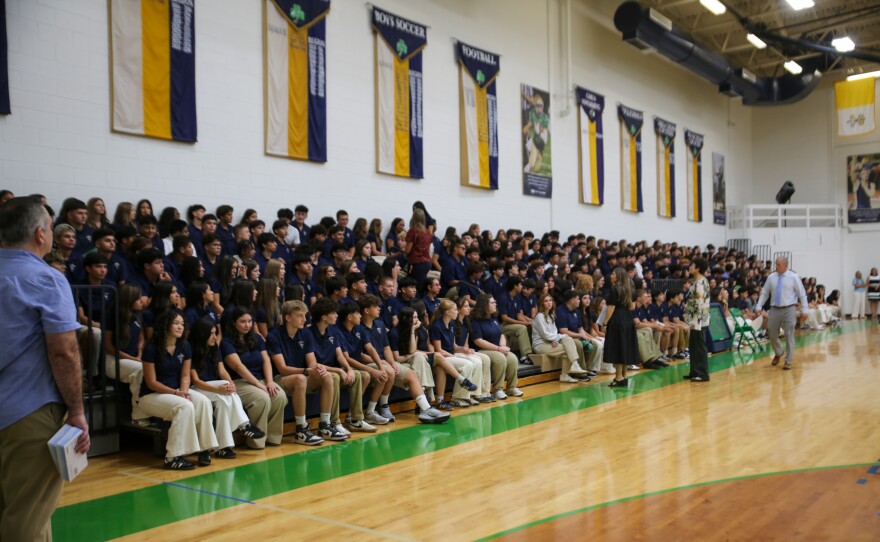 Faculty and staff walked along the bleachers, ensuring order.