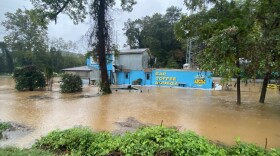 Severe flooding in Asheville on Sept. 26, 2024 at Day Trip bar and bodega along the French Broad River.