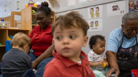 Andrene Cross-Rozario and Eva Goldburn, educators at Hope Child Development Center, play with their students. Leaders at centers like this one are concerned they won’t be able to pay the staff they need when federal emergency COVID funding runs out this year.