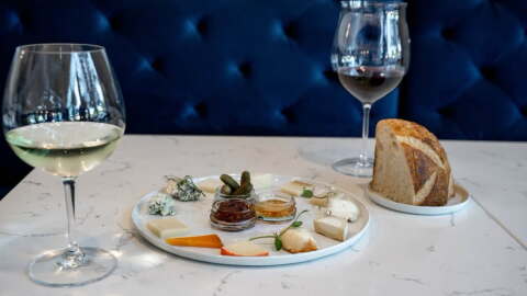 At Vintage '78 Wine Bar, The Cheese Clock offers an opportunity to try 12 different cheeses and accoutrements on one plate.