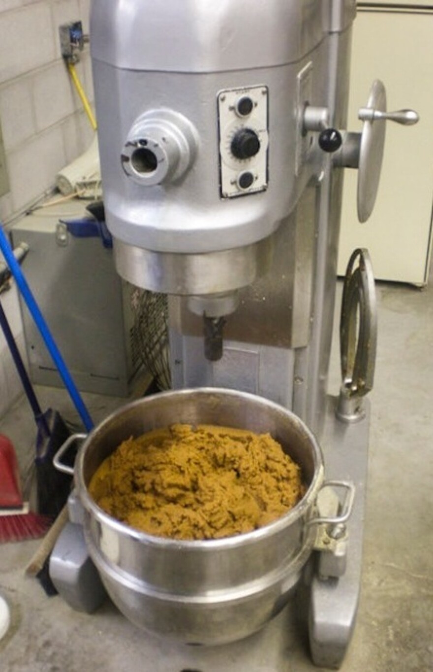 Soybean paste is mixed to the right consistency and moisture content to produce fake poop at the Maximum Performance factory.