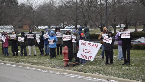 About two dozen people protested outside of the Immigration and Customs Enforcement field office in Westerville on December 19, 2025.