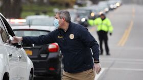 Monroe County Executive Adam Bello handing out masks in Irondequoit on Saturday.