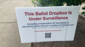Signs like this one at the Broadview library branch in north Seattle popped up at some King County ballot drop boxes in July. They prompted concerns about voter intimidation and ultimately an investigation by the King County Sheriff's Office.
