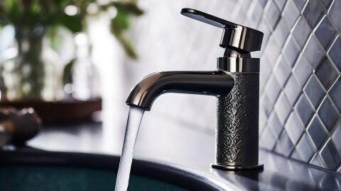 Water streams out of a faucet.