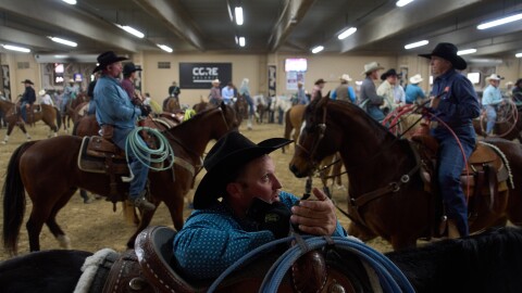 Contestants wait to compete during the World Series of Team Roping at the South Point hotel-casino in Las Vegas Tuesday, Dec. 9, 2025, in Las Vegas. (AP Photo/John Locher)
