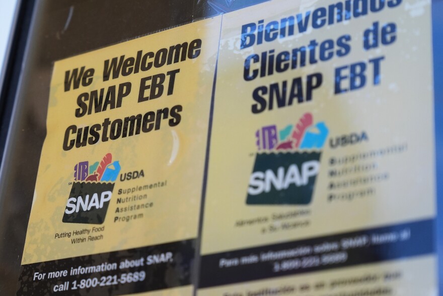 FILE - A SNAP EBT information sign is displayed outside of a convenience store in Baltimore, Monday, Nov. 10, 2025. (AP Photo/Stephanie Scarbrough)