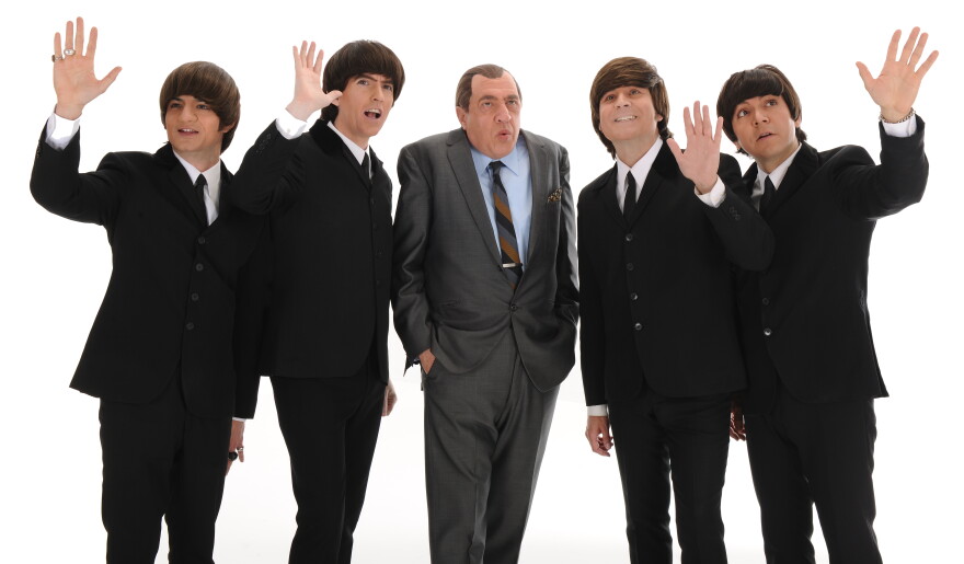 Members of Beatles tribute band The Fab Four with the actor portraying Ed Sullivan in a publicity shot from the band