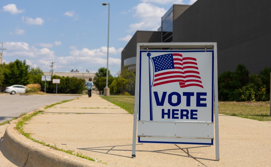 A voter makes her way inside Saginaw United high school to cast her ballot in the August 4 primary election.