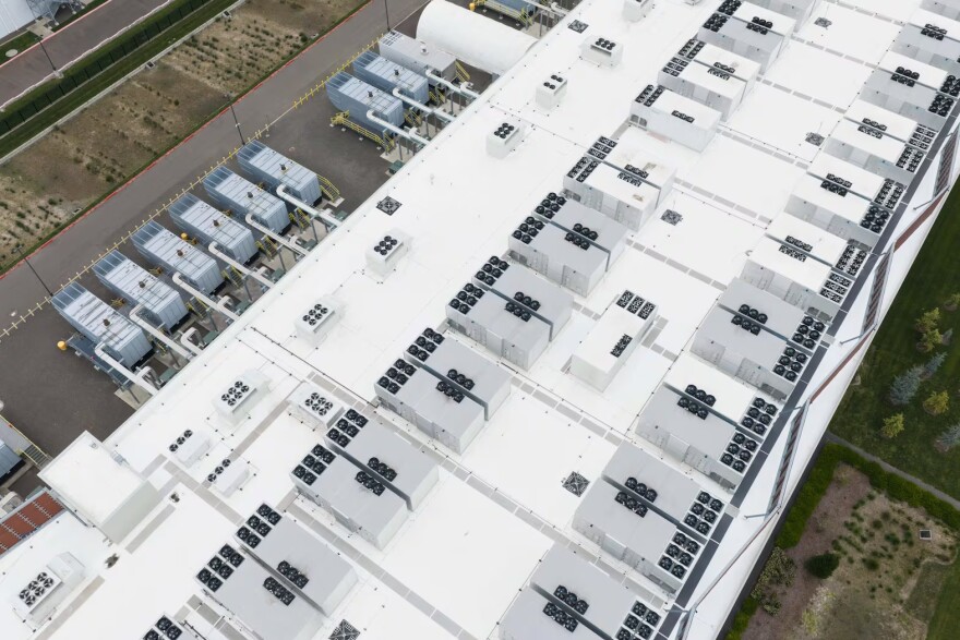 Fans that are part of a cooling system are seen on the roof of a data center, Monday, April 27, 2026, in Hillsboro, Ore.