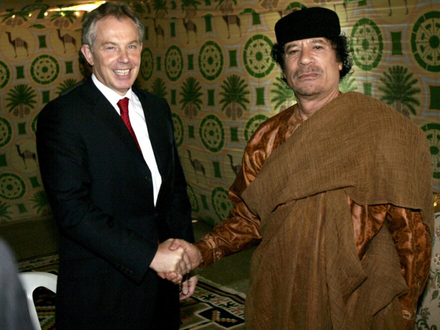 In a switch, Britain's impounding of around $1.5 billion in Libyan cash might have Moammar Gadhafi regretting the thaw between the two nations, brokered by Prime Minister Tony Blair. Here, the two pose at Gadhafi's desert base south of Tripoli in 2007.