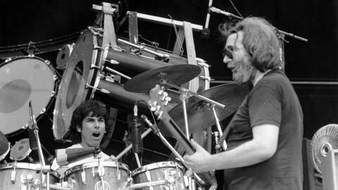 The Grateful Dead open up the final day of the US Festival in San Bernardino, Ca. early Sunday morning on Sept. 5, 1982. Guitarist Jerry Garcia, right, and drummer Mickey Hart play music spanning two decades to an enthusiastic crowd of rock and roll fans.  (Lennox Mclendon/AP)