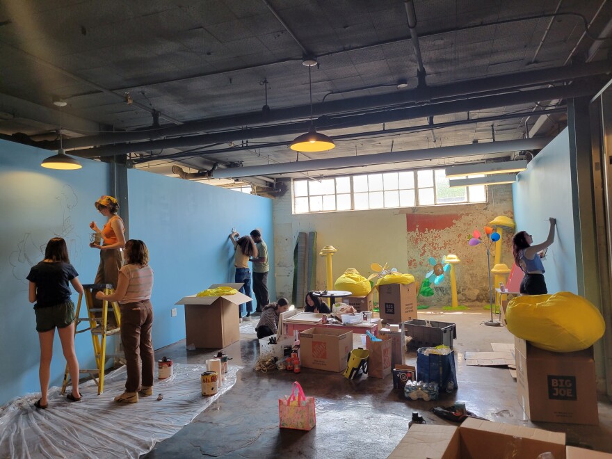 High school students from the Currently Under Creation program paint and draw a “Sweet and Sour” reading room at 78th Street Studios in Cleveland. 