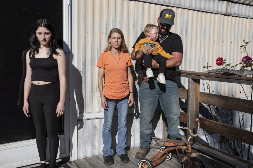 "No one understands it," says Sylvia Cunningham of how she and her husband, Brandon, holding Braxton, 2, got three of their children returned from foster care, including daughter Jordan, 17 (at left), but a court allowed one son to be placed for adoption because the Cunninghams had failed to pay part of the bill for foster care.