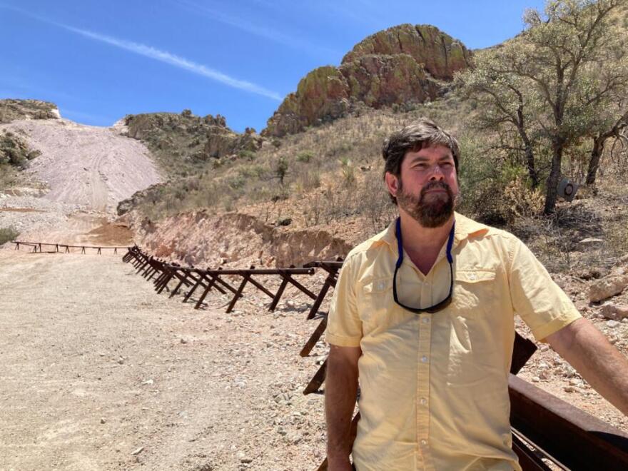 Myles Traphagen, pictured in 2021, at the site of the unfinished border wall in Arizona. (Peter O’Dowd/Here & Now)