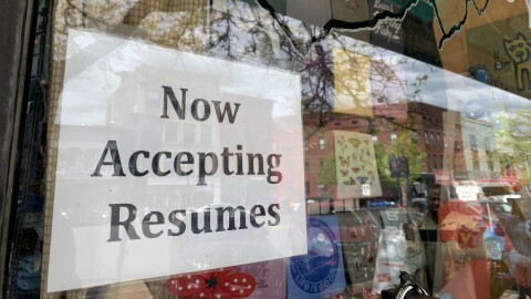 A sign outside Synergy, in downtown Northampton, Massachusetts, informs those passing by that the store is accepting resumes.