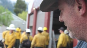 Dillon Sanders looks on as a collection of wildland firefighters train for an upcoming season. Sanders is the owner of Inbound LLC in Oakridge, Oregon, which runs 20-person hand crews and 13 engines for fire suppression. CREDIT: TONY SCHICK