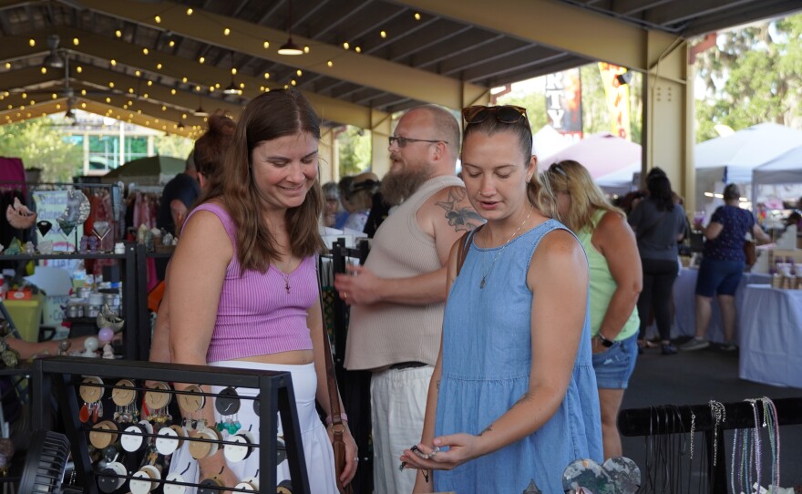 Eventgoers browse jewelry at Girls Night Out at the Ocala Downtown Market in Ocala, Fla., on June 6, 2026.