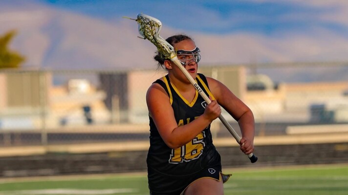 Kaitlyn Campbell playing lacrosse.