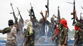 Fighters with the Movement for the Emancipation of the Niger Delta (MEND), pictured in 2008. The rebel group claimed responsibility for the kidnapping.