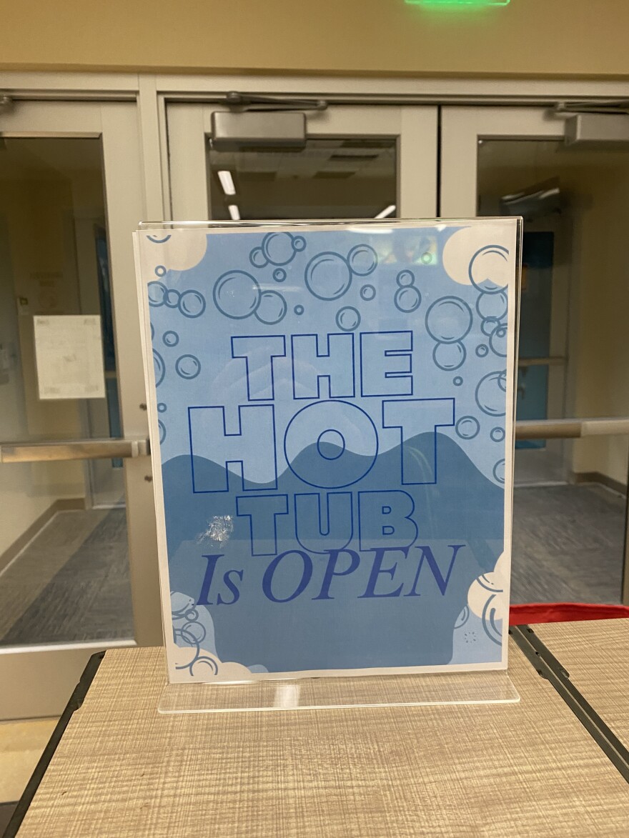 A sign at the Yukon-Kuskokwim Fitness Center declares the hot tub open after it's new pump was installed. November 17, 2025 in Bethel, AK. 