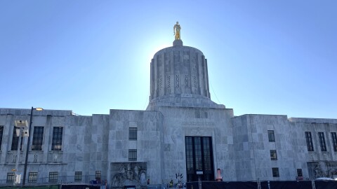The Oregon Capitol. Construction equipment and fencing is seen in the foreground. 