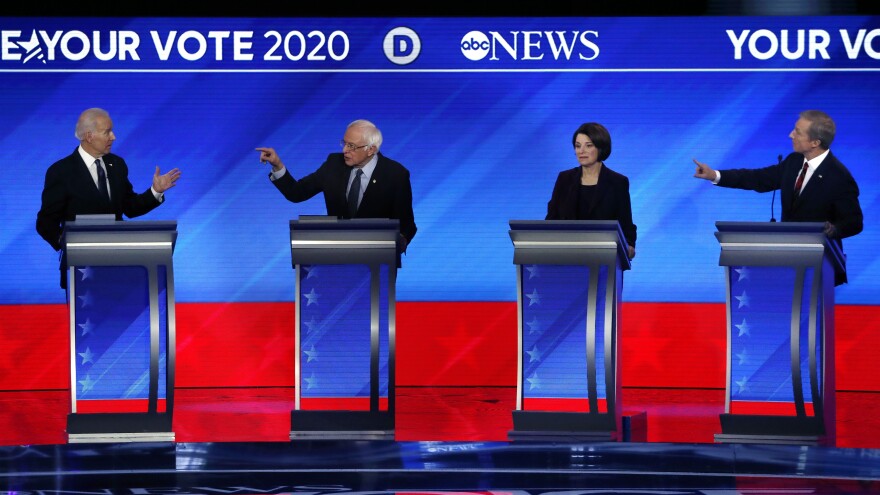 From left, Democratic presidential candidates former Vice President Joe Biden, Sen. Bernie Sanders, I-Vt., Sen. Amy Klobuchar, D-Minn., and businessman Tom Steyer participate in a Democratic presidential primary debate Feb. 7, in Manchester, N.H.