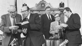 After the Senate Watergate Committee hearings concluded Friday, August 3,1973 in Washington the reading of a statement by L. Patrick Gray III, former director of the FBI, Senators and counsel held a session. Rufus Edmisten is on the right.