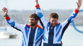 Andrew 'Bart' Simpson stands to the left of fellow sailor Iain Percy at the London 2012 Olympic Games.