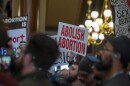 A group of anti-abortion rights protester called on lawmakers to put restrictions on abortion pills sent by mail at the Iowa Capitol Feb. 9, 2026.