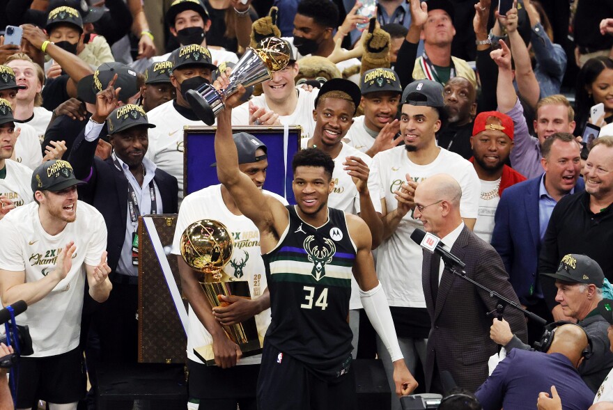 Giannis Antetokounmpo #34 of the Milwaukee Bucks celebrates winning the Bill Russell NBA Finals MVP Award after defeating the Phoenix Suns in Game Six to win the 2021 NBA Finals at Fiserv Forum on July 20, 2021 in Milwaukee, Wisconsin.