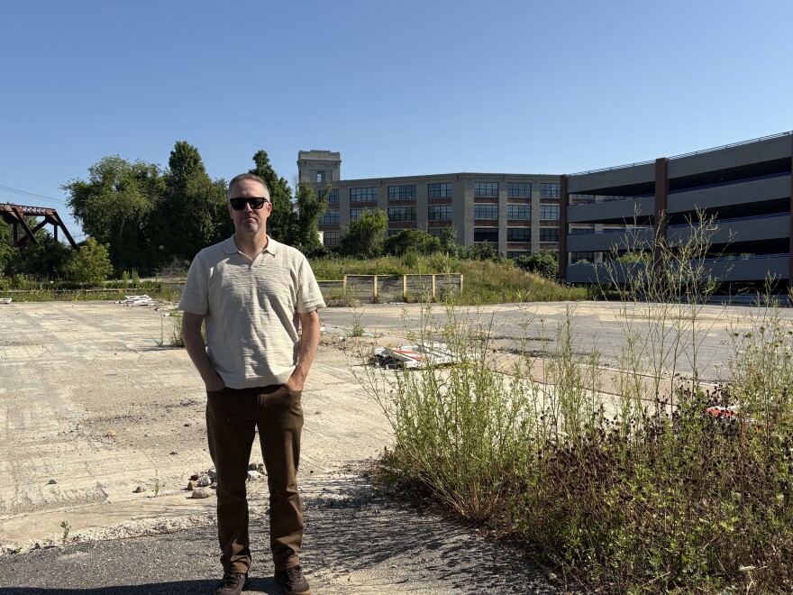 Tyler Norod, president of the Westbrook Housing Development Corporation, stands at the future site of Quebec Commons, a 45-unit apartment building for older Mainers that's planned for Biddeford's historic mill district.