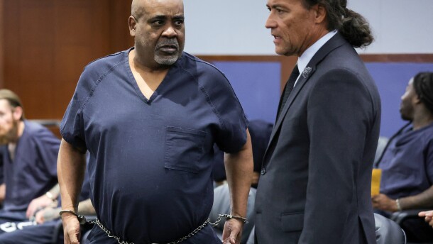 Duane Davis, left, talks with his attorney Michael Sanft in Clark County District Court during a calendar call and motion hearing for Davis' upcoming trial, Tuesday, Aug. 4, 2026, in Las Vegas. (Ethan Miller/Pool Photo via AP)