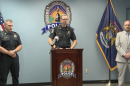 Lansing Police Chief Rob Backus in the middle talking. 