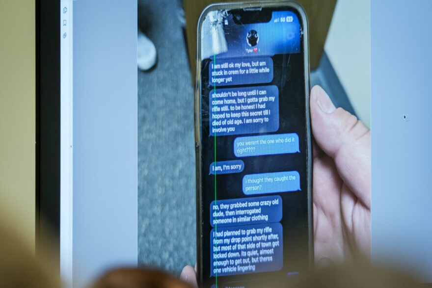 A photograph which prosecutors say shows a text message exchange between Tyler Robinson, who is accused in the fatal shooting of Charlie Kirk, and Robinson’s roommate and romantic partner Lance Twiggs, is shown during a preliminary hearing at the Fourth District Courthouse in Provo, Utah, July 9, 2026.