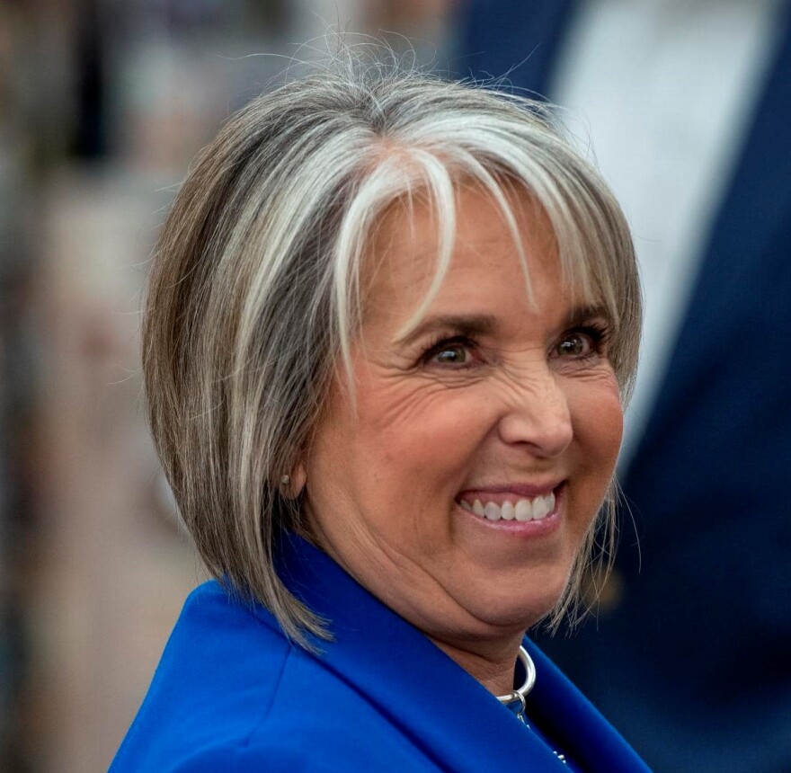 Governor Michelle Lujan Grisham talks with people at Duran's Centeral Pharmacy on Election Day, Tuesday November 8, 2022. (Eddie Moore/Albuquerque Journal)