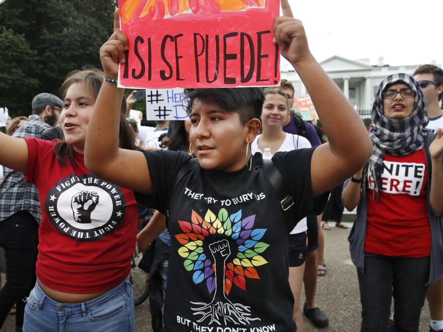 Juliana Torres (left), 16, and Micaela Lattimer, 16, both of Baltimore, rally in support of Deferred Action for Childhood Arrivals, known as DACA, outside the White House on Tuesday.