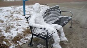 University of Alabama students build a snowman on a bench outside of Bryant-Denny stadium