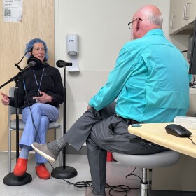 Dr. Kristen Scarpato interviews with Fred Sauceman in an exam room.