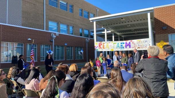  People watching a stage with children