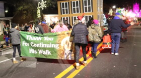 Members of the Ballard family walk in Thursday’s Bardstown Christmas Parade. Tommy Ballard was shot to death while hunting in 2016; his daughter Crystal Rogers disappeared in 2015.