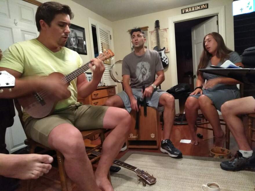 Angelo, Lucas and Laura Manzi, rehearsing with their family.