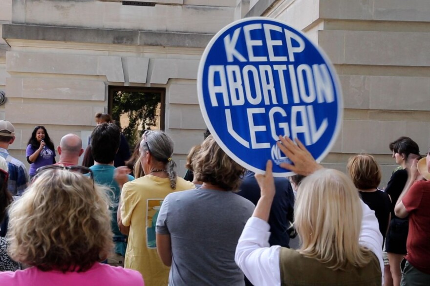 A crowd gathered Monday to protest Indiana's abortion ban. The protests were organized by Hoosier Jews for Choice, Indiana NOW, and MADVoters.