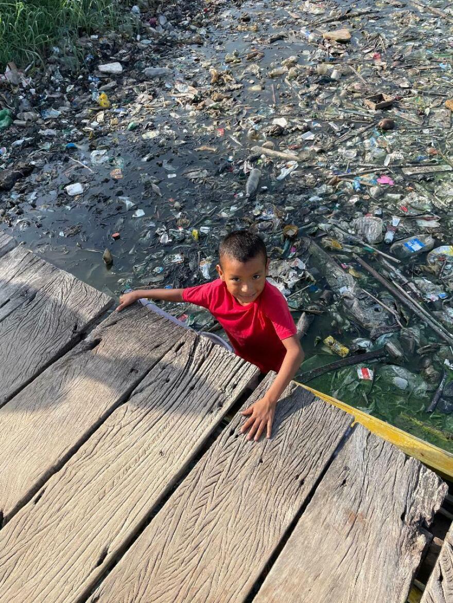 The people of the lakeside community of Santa Rosa mostly avoid the tainted waters of Lake Maracaibo in Venezuela. Kids play a lot of soccer but only a few dare venture into the lake.